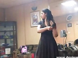 indian wife in bedroom dancing for hubby to..